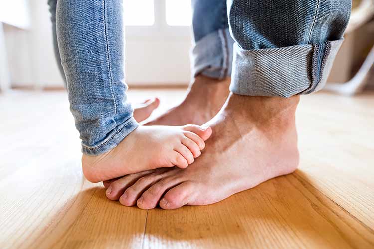 bare feet on wood floor